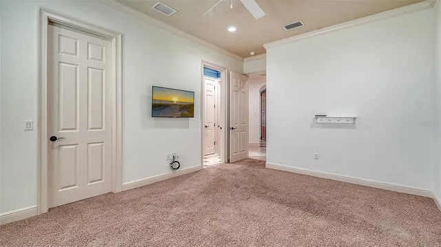 a living room with lots of furniture and a large window
