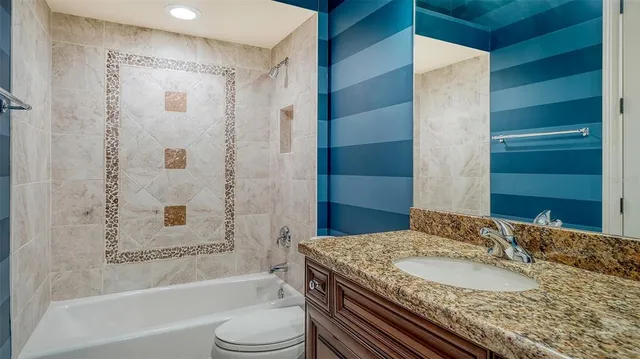 a view of a dining room with furniture large windows and wooden floor