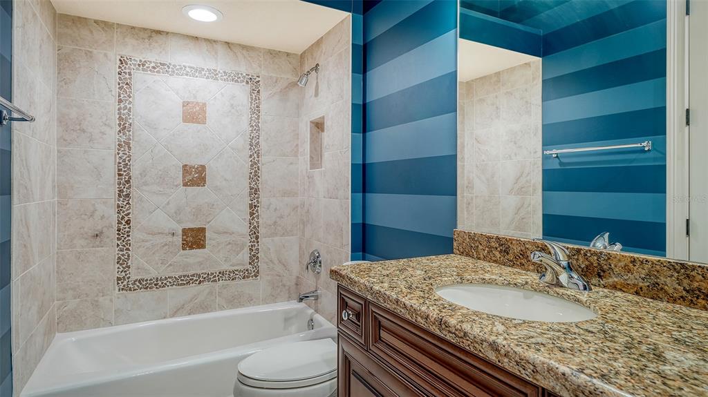 3218 Signet Court Sarasota, FL 34240 - Photo 48 of 82 a bathroom with a granite countertop sink toilet and shower