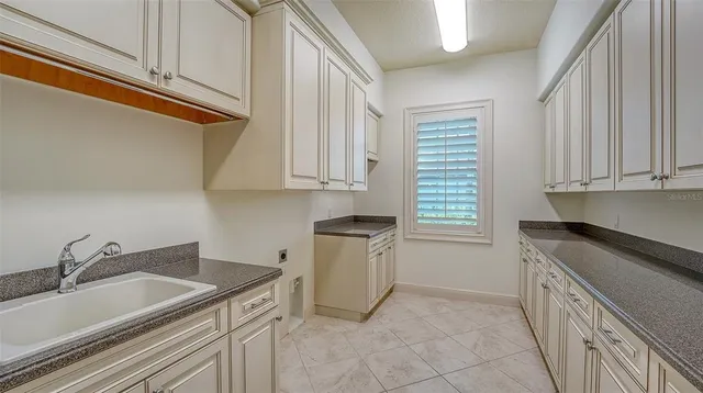 a view of a golf course with a large trees