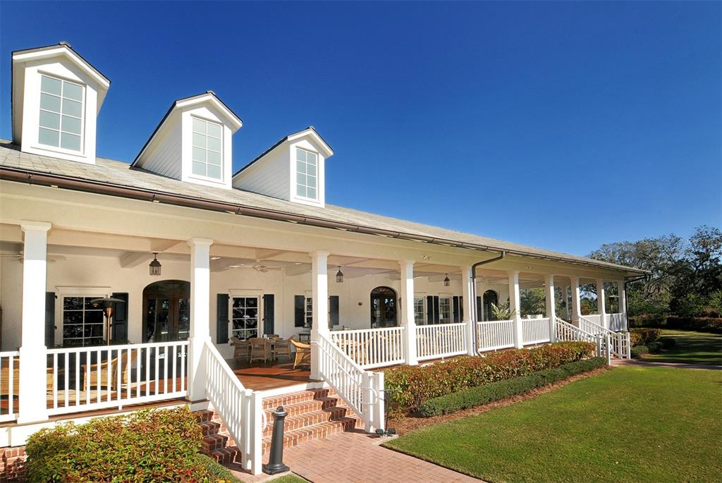 3218 Signet Court Sarasota, FL 34240 - Photo 67 of 82 a front view of a house with a yard