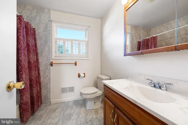 a bathroom with a sink and a toilet