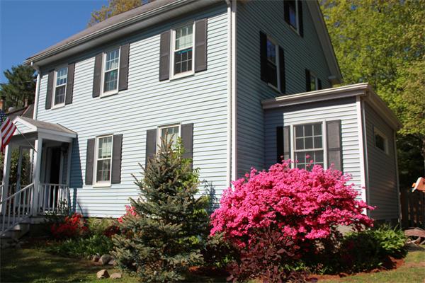 51 Grove Road Natick, MA 01760 - Photo 1 of 18 a pink flowers in front of the house