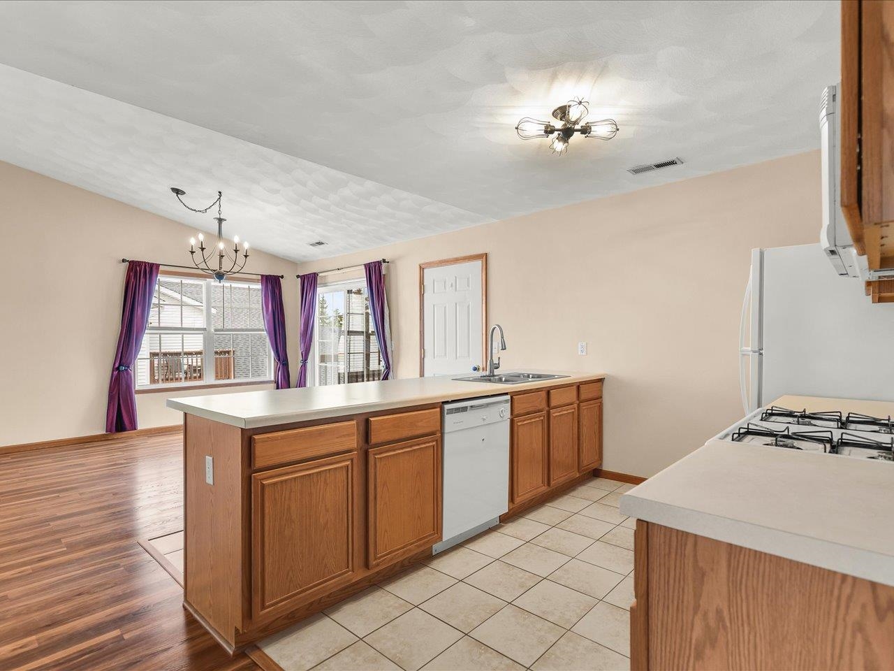 10184 Metalmark Lane Roscoe, IL 61073 - Photo 14 of 29 a kitchen with a sink and cabinets
