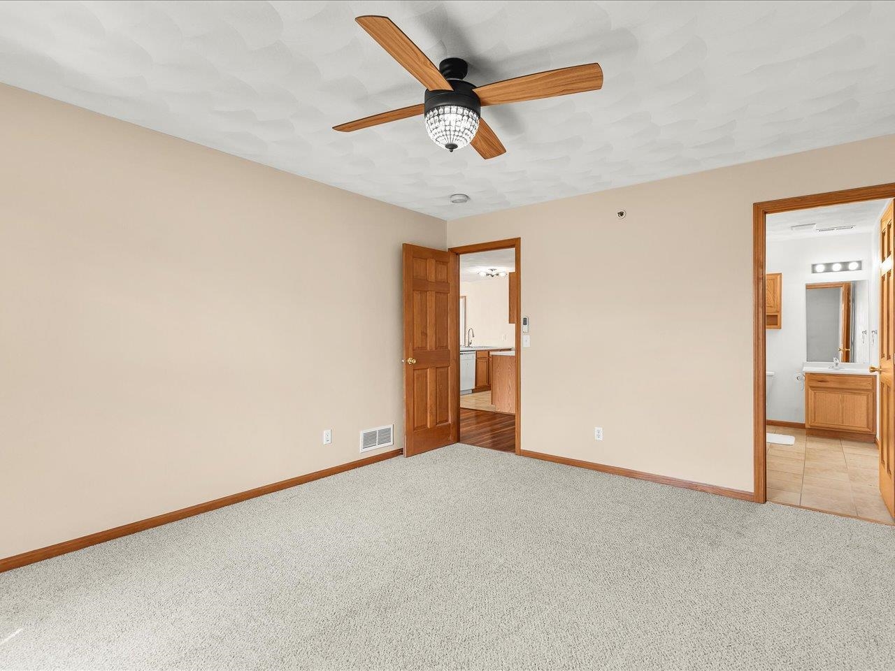 10184 Metalmark Lane Roscoe, IL 61073 - Photo 18 of 29 an empty room with closet and fan