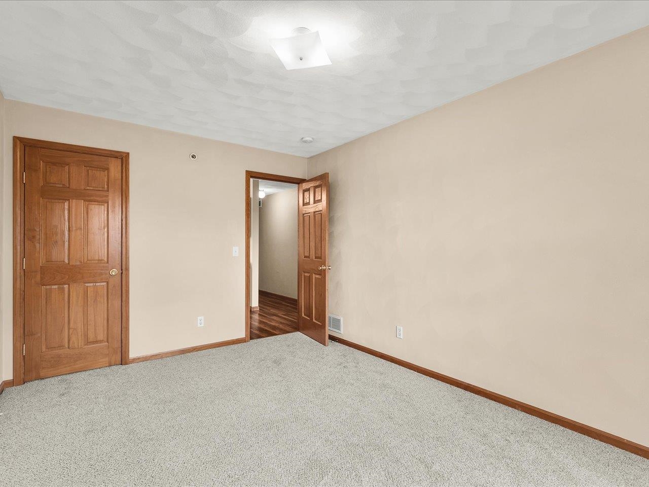 10184 Metalmark Lane Roscoe, IL 61073 - Photo 23 of 29 an empty room with closet area