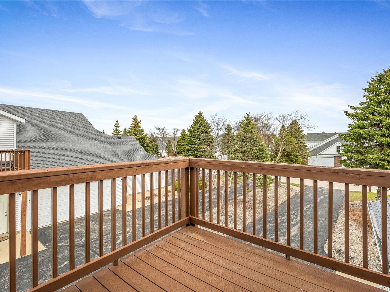 10184 Metalmark Lane Roscoe, IL 61073 - Photo 27 of 29 a balcony with wooden floor and fence