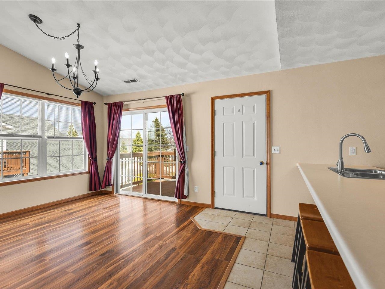 10184 Metalmark Lane Roscoe, IL 61073 - Photo 5 of 29 a view of a room with wooden floor and windows