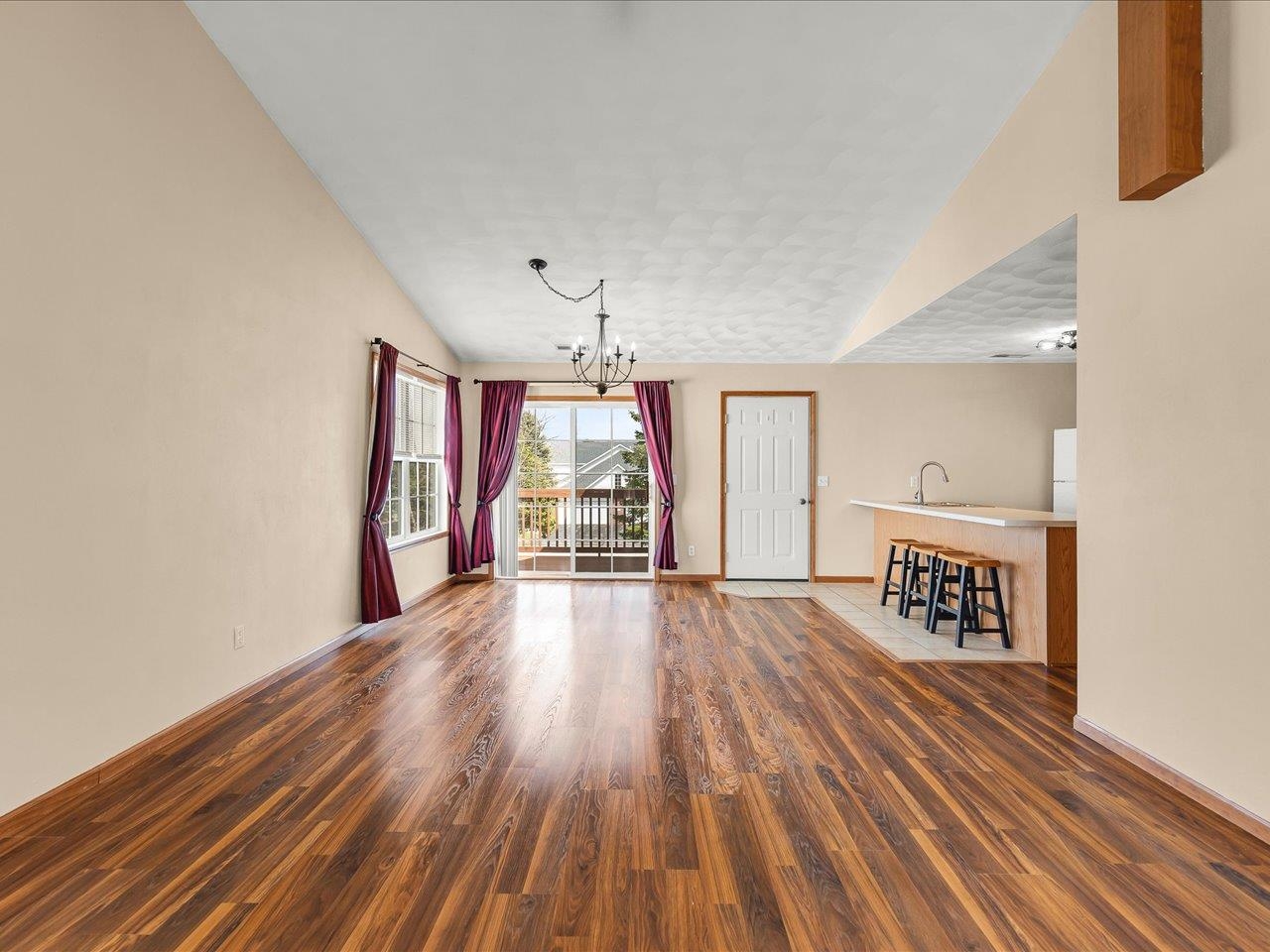 10184 Metalmark Lane Roscoe, IL 61073 - Photo 7 of 29 a view of a room with wooden floors and natural light
