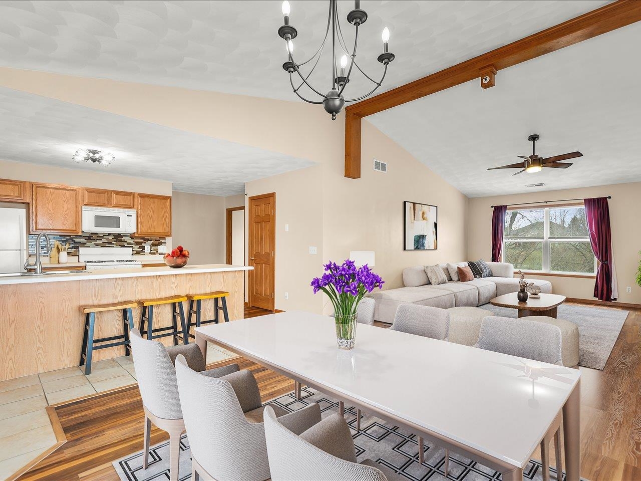 10184 Metalmark Lane Roscoe, IL 61073 - Photo 10 of 29 a view of a dining room with furniture and a chandelier