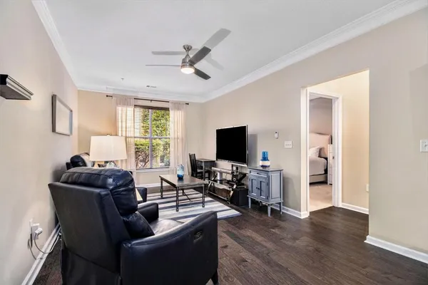 a living room with furniture and a flat screen tv