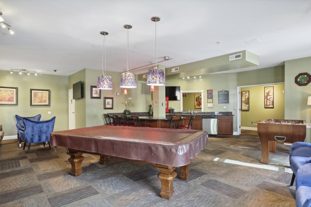 10 Perimeter Summit Boulevard, Unit 2112 Atlanta, GA 30319 - Photo 32 of 40 a dining room with furniture and wooden floor