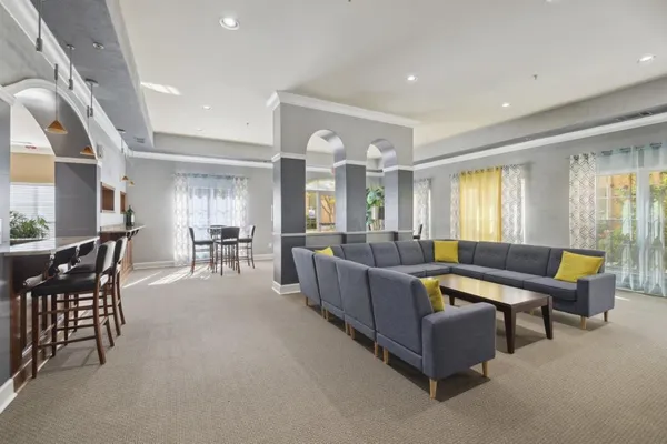 a living room with furniture and a large window