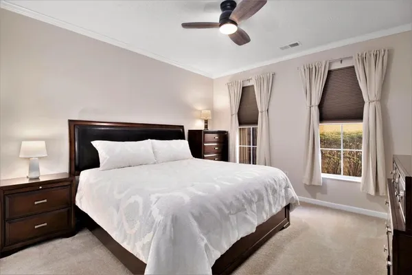 a bedroom with a large bed and a closet