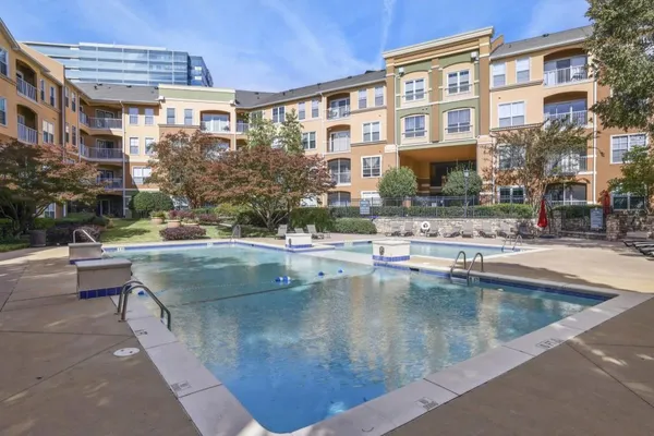 a view of a swimming pool with a outdoor seating