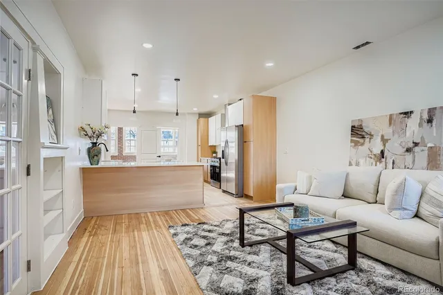 a living room with furniture and a rug
