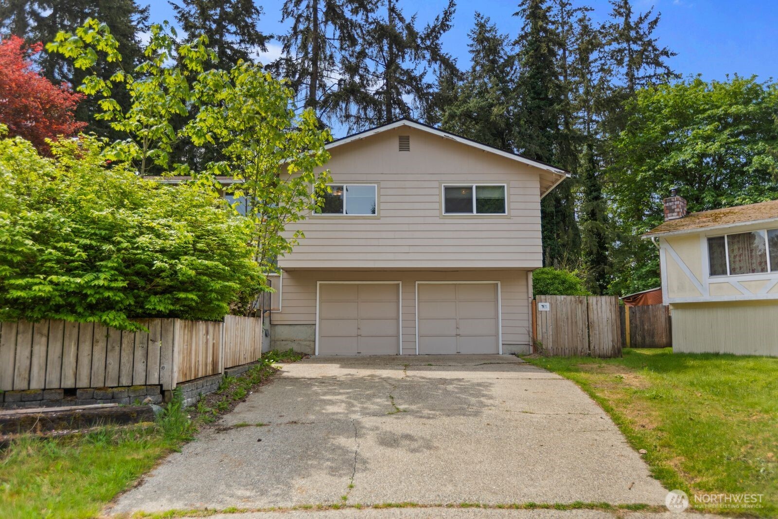 21627 9th Place West Bothell, WA 98021 - Photo 38 of 40 a front view of a house with a yard and garage