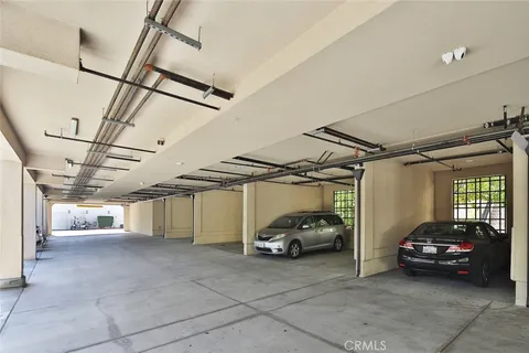 a view of parking garage with cars