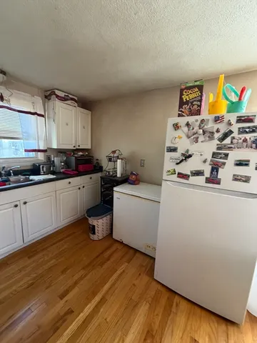 a kitchen with stainless steel appliances a stove a sink and a refrigerator