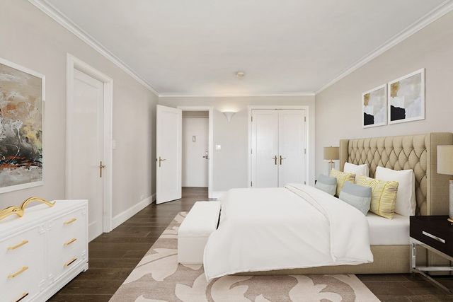 a spacious bedroom with a bed and a couch