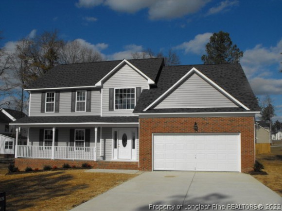 81 Persimmon Path Sanford, NC 27332 - Photo 1 of 1 a front view of a house with a yard