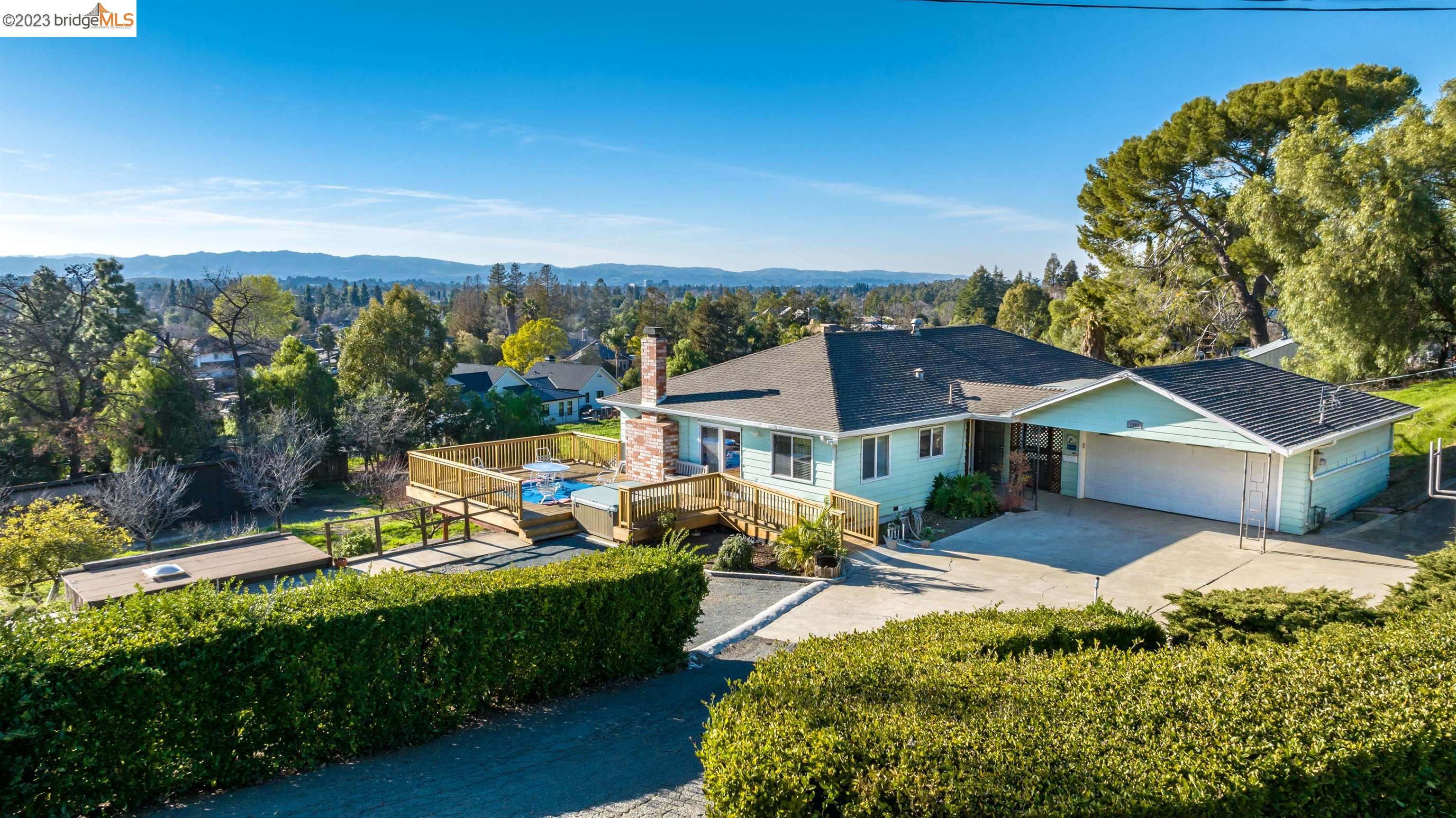 an aerial view of a house with a garden