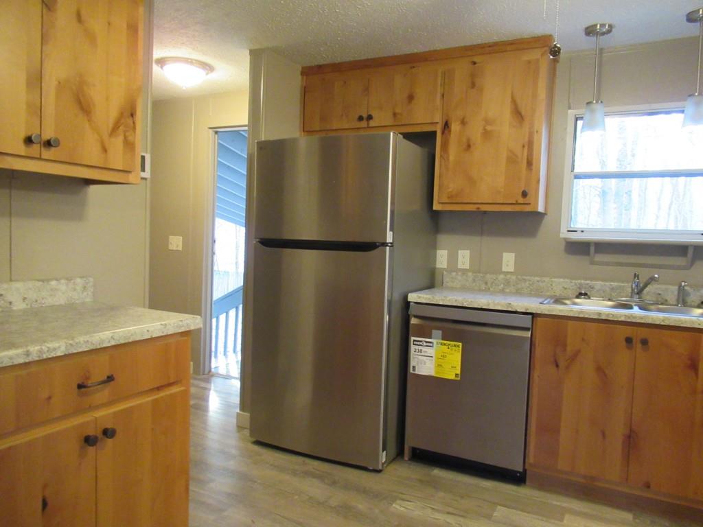 61 Berry Patch Lane Cleveland, GA 30528 - Photo 13 of 23 a kitchen with stainless steel appliances granite countertop a refrigerator and a sink