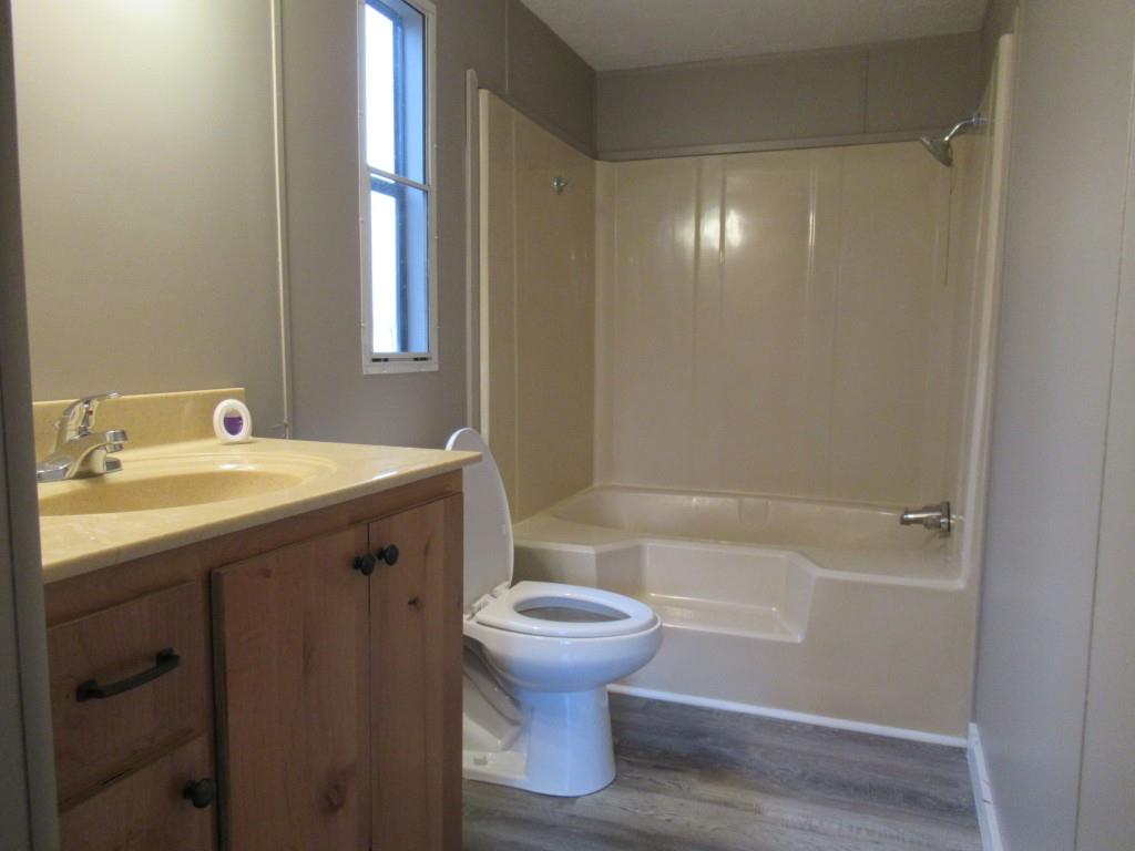 61 Berry Patch Lane Cleveland, GA 30528 - Photo 17 of 23 a bathroom with a sink toilet and shower