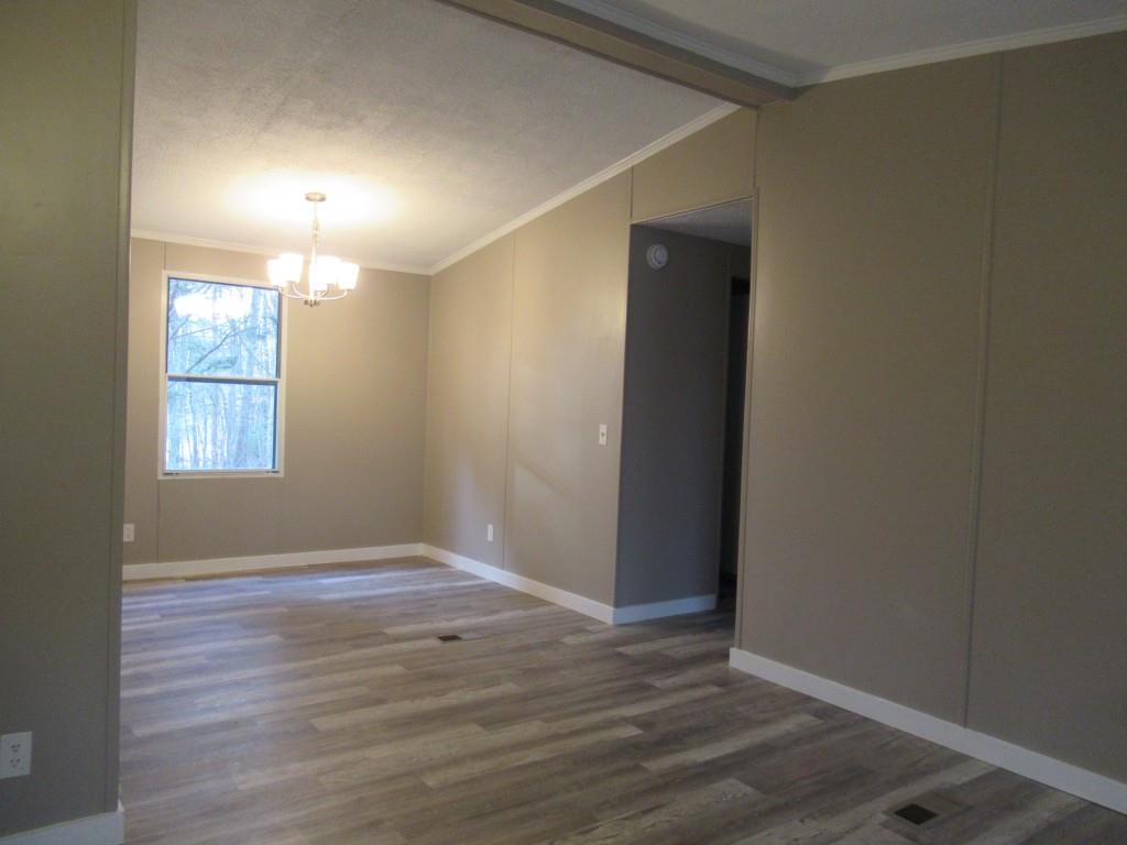 61 Berry Patch Lane Cleveland, GA 30528 - Photo 18 of 23 an empty room with wooden floor and windows