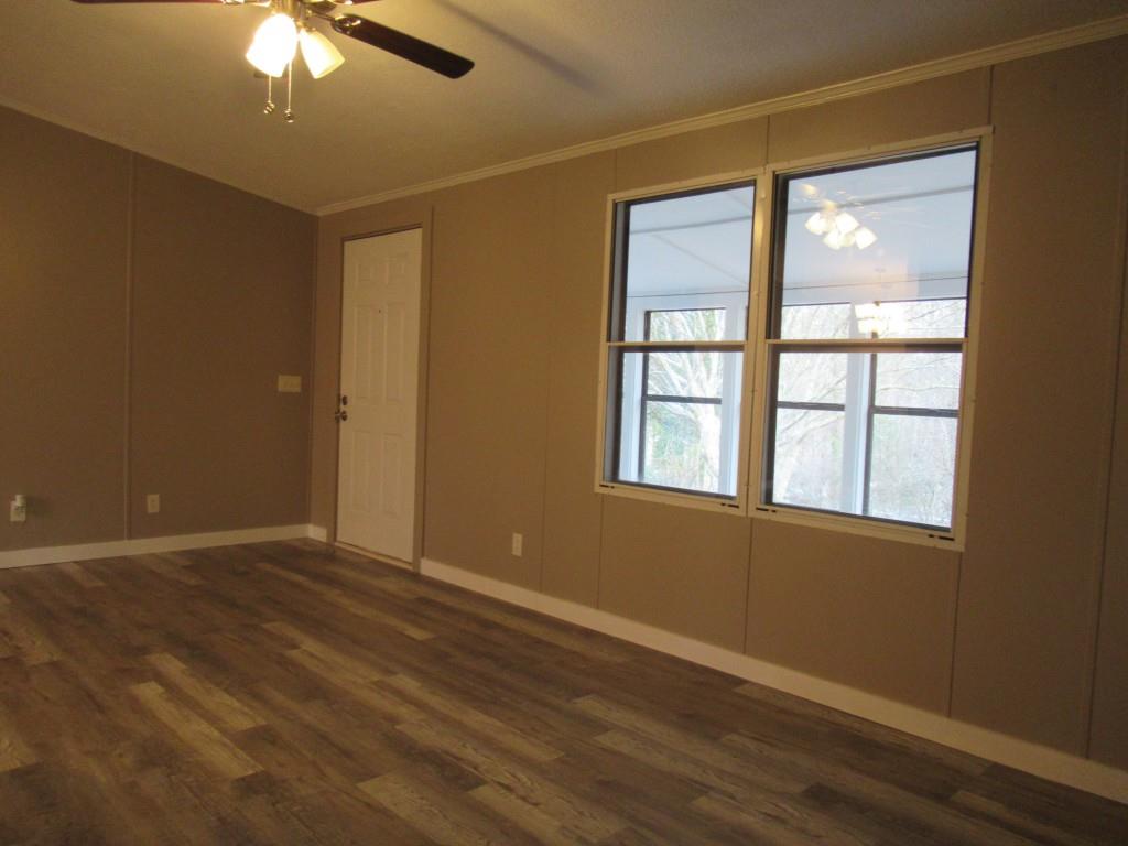 61 Berry Patch Lane Cleveland, GA 30528 - Photo 19 of 23 a view of an empty room with wooden floor and a window
