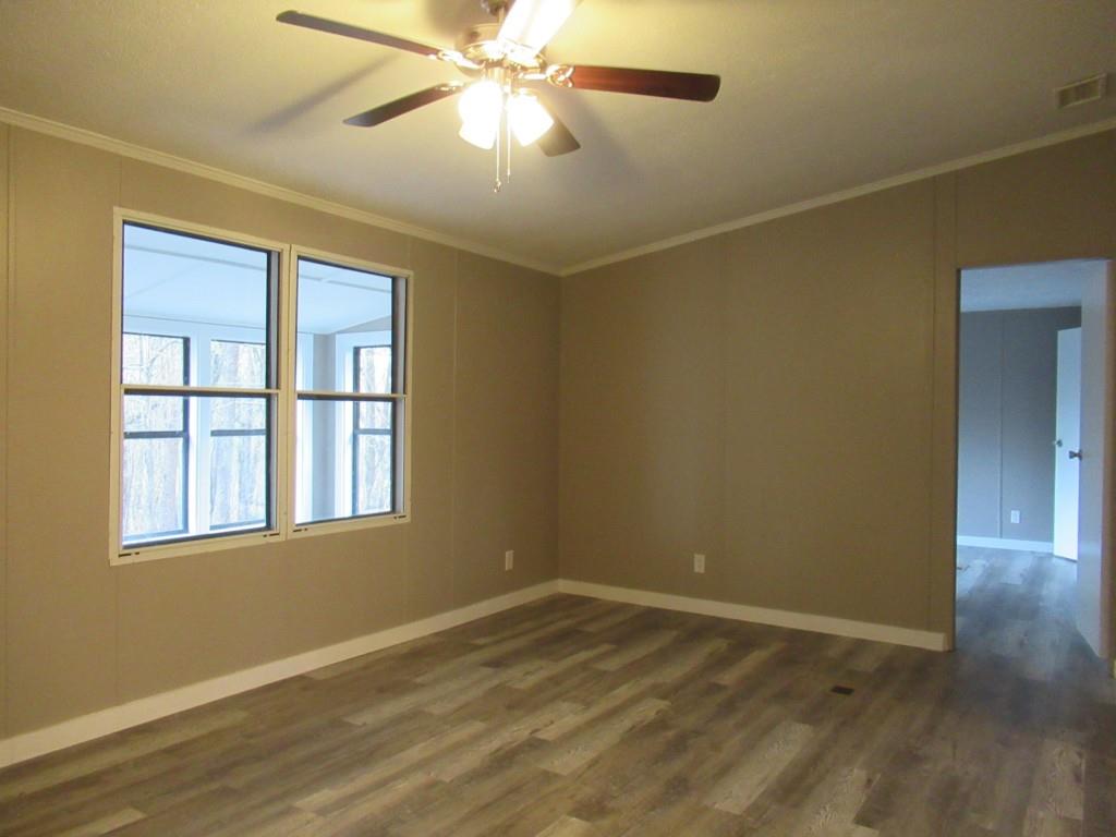 61 Berry Patch Lane Cleveland, GA 30528 - Photo 21 of 23 a view of an empty room with wooden floor and a window