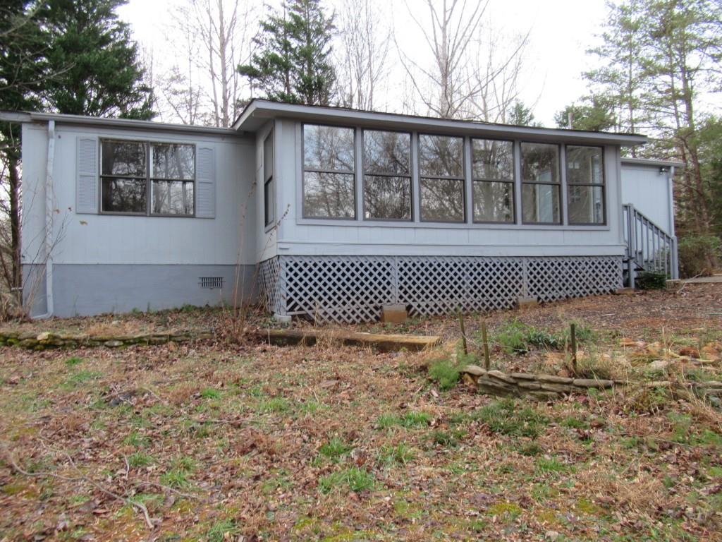 61 Berry Patch Lane Cleveland, GA 30528 - Photo 4 of 23 a front view of a house with a garden