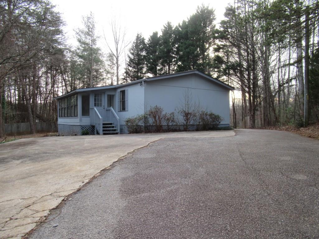 61 Berry Patch Lane Cleveland, GA 30528 - Photo 5 of 23 a backyard of a house with large trees