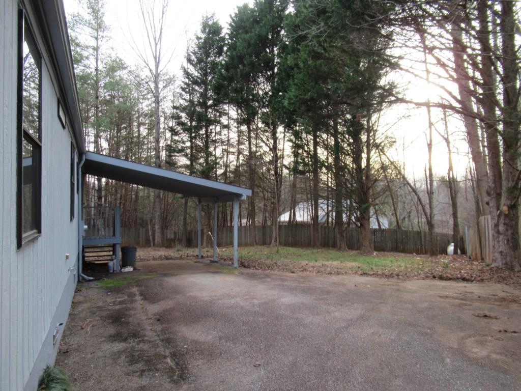 61 Berry Patch Lane Cleveland, GA 30528 - Photo 6 of 23 a view of outdoor space with deck and tree