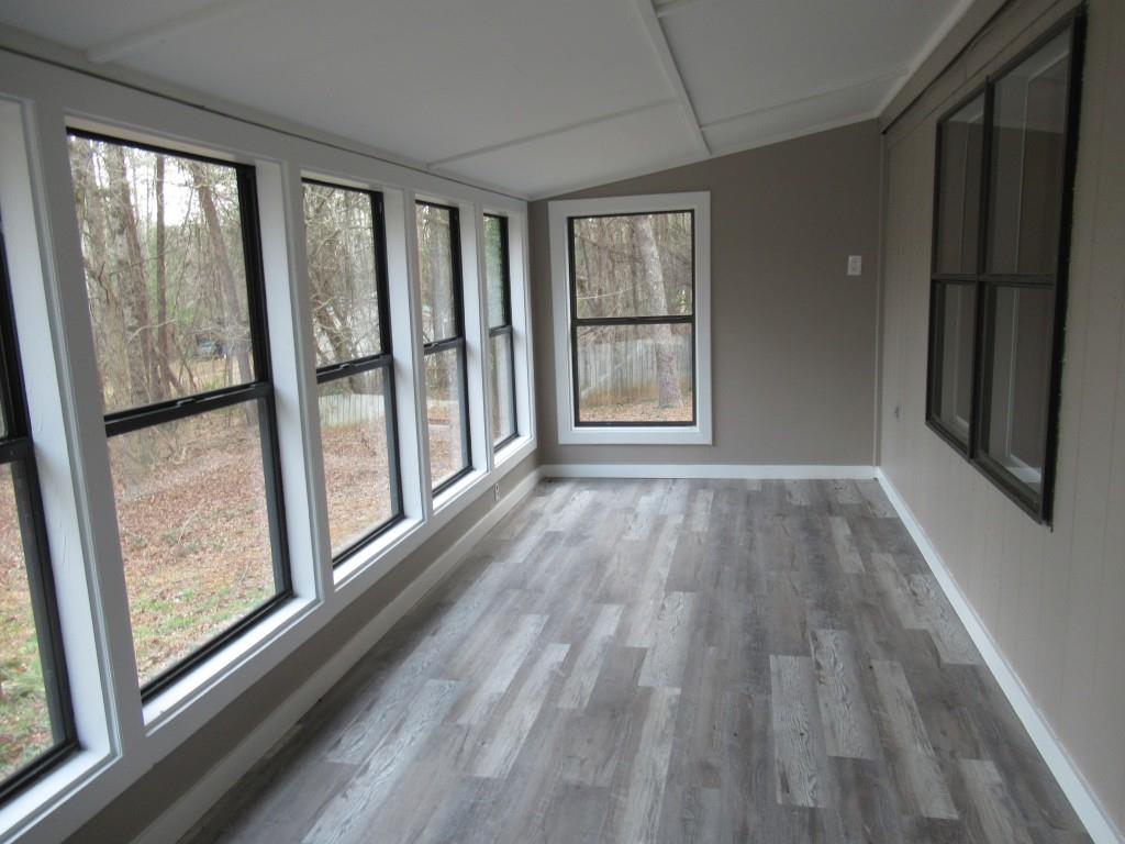 61 Berry Patch Lane Cleveland, GA 30528 - Photo 8 of 23 a view of an empty room with wooden floor and a window