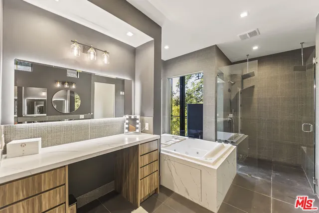 a view of a balcony with wooden floor and outdoor seating