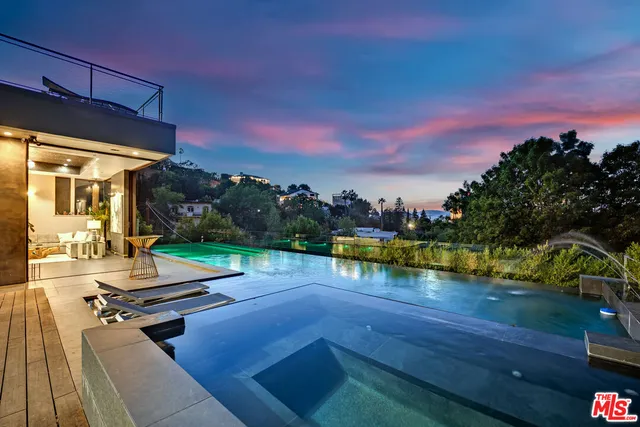 a view of a patio with swimming pool