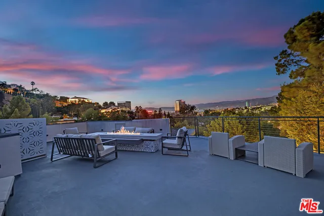 a view of a patio with a yard