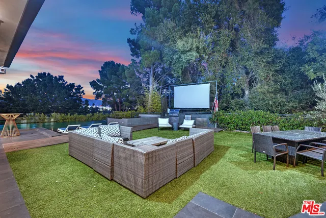 a view of a livingroom with furniture and a window