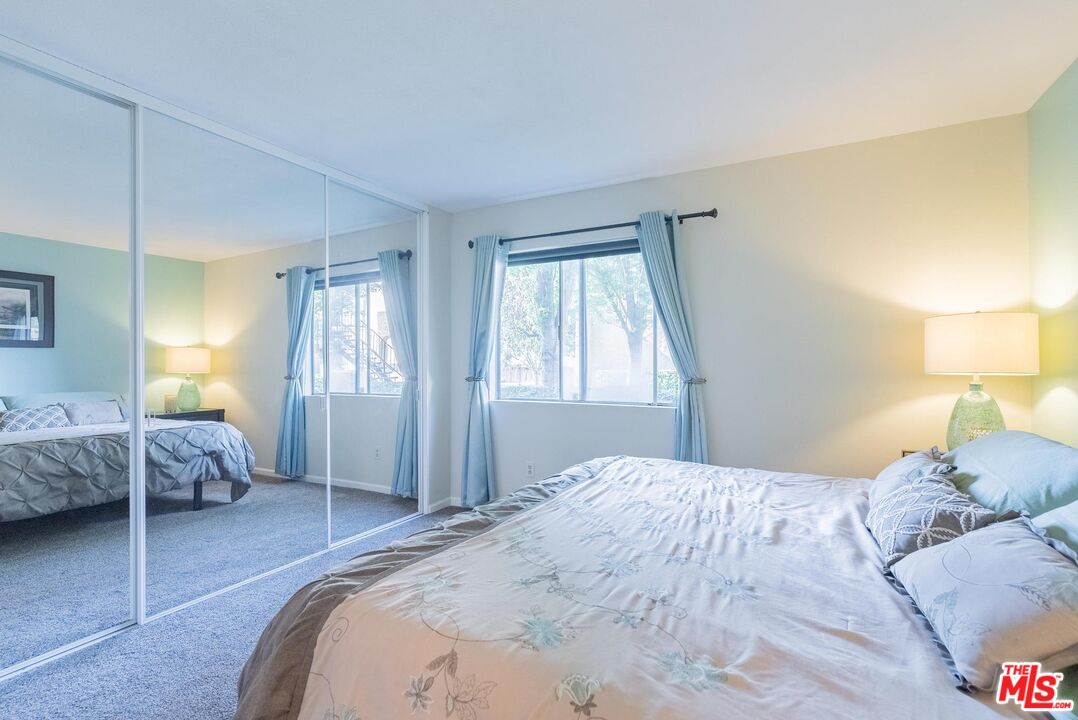2567 Grambling Lane Riverside, CA 92507 - Photo 21 of 38 a bedroom with a bed and a window