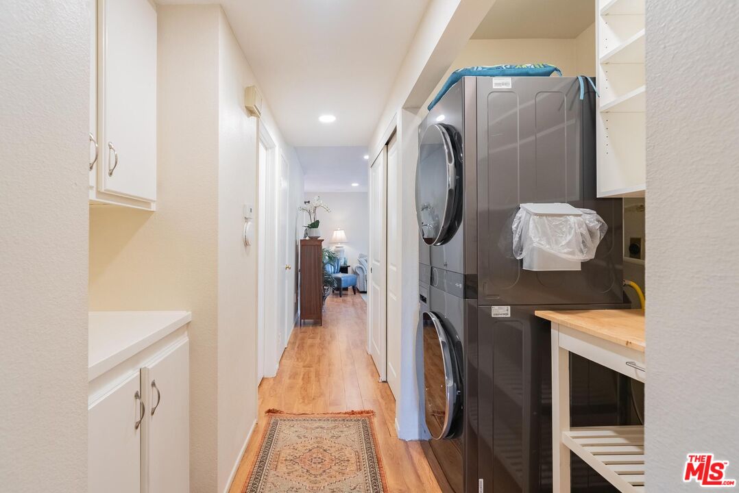 2567 Grambling Lane Riverside, CA 92507 - Photo 28 of 38 a hall way with furniture a washer and dryer