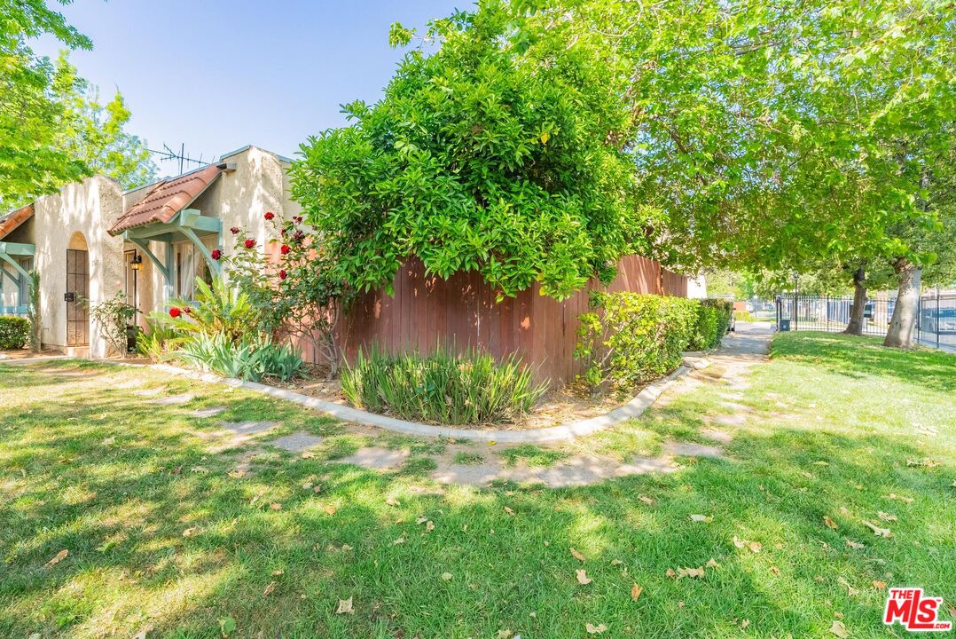 2567 Grambling Lane Riverside, CA 92507 - Photo 3 of 38 a view of a yard with plants and a fountain