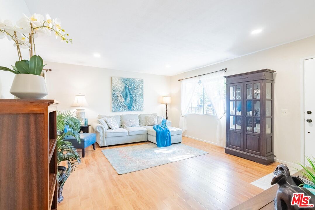 2567 Grambling Lane Riverside, CA 92507 - Photo 7 of 38 a living room with furniture and wooden floor