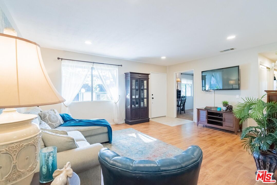 2567 Grambling Lane Riverside, CA 92507 - Photo 9 of 38 a living room with furniture and a potted plant