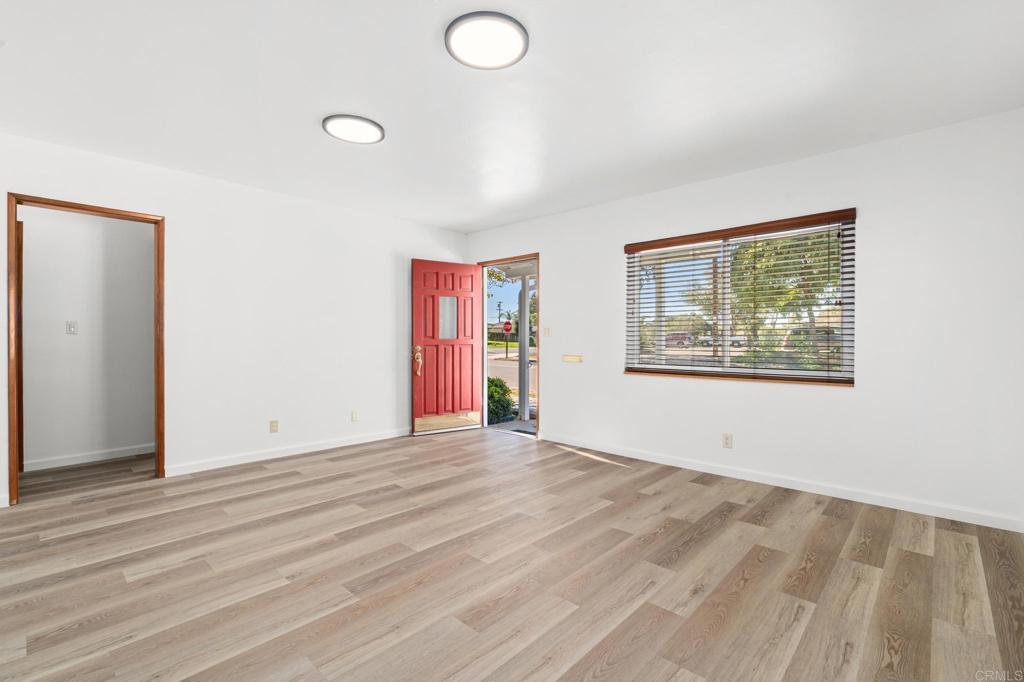 549 D Street Ramona, CA 92065 - Photo 19 of 44 a view of an empty room with wooden floor and window