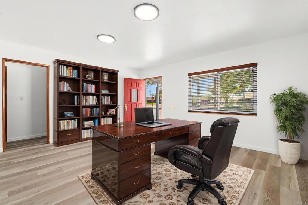 549 D Street Ramona, CA 92065 - Photo 20 of 44 a view of a workspace with furniture and a potted plant