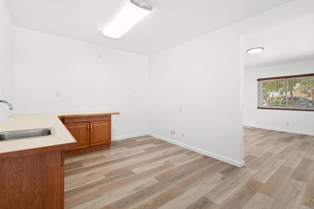 549 D Street Ramona, CA 92065 - Photo 23 of 44 a view of a room with wooden floor and cabinet