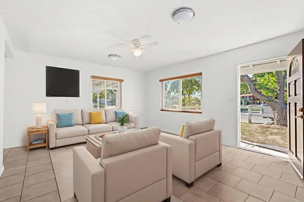 a living room with furniture and a flat screen tv