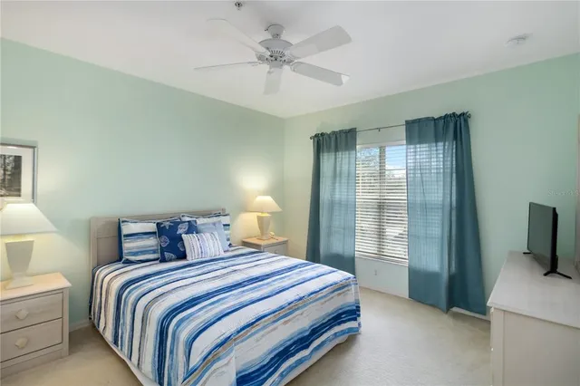 a bedroom with a bed and a tv