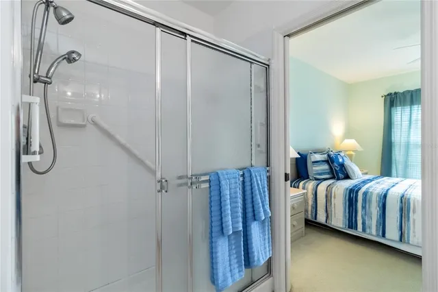 a bedroom with a bed and a mirror